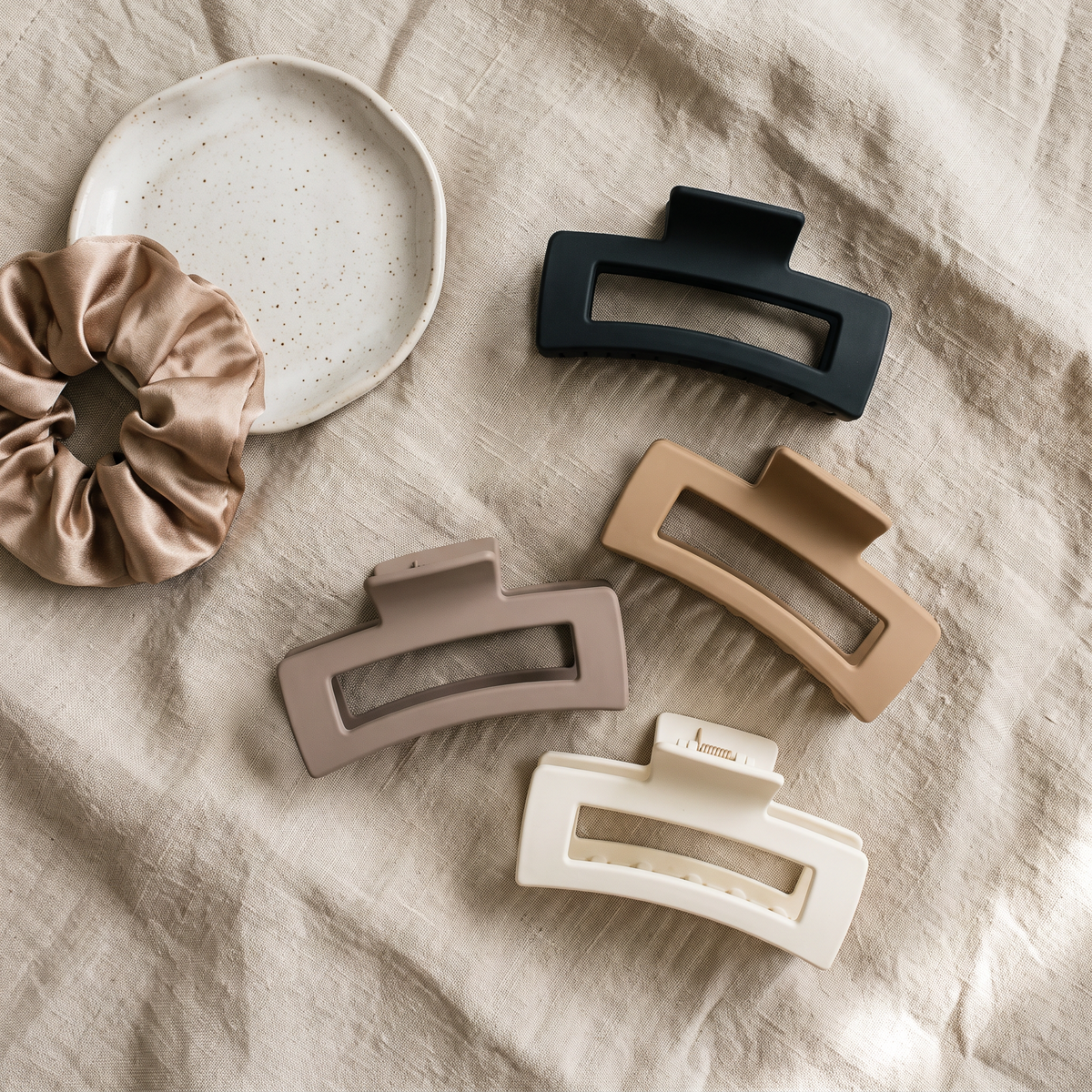 Four matte claw clips in neutral shades